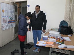 Measuring weight of the beneficiary at the camp