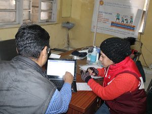 Beneficiary using the Portable Health Information Kiosk to identify the risk factors associated with his health condition